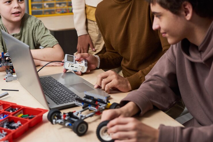 Header image: Students working together on various STEM projects — robotics, coding, design, and electronics — representing the balance of creativity and technical skill