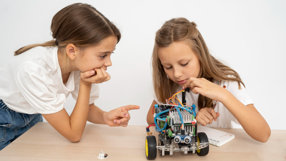 Photo: Kids testing a small robot they built