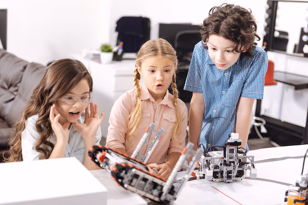 Photo: Teacher guiding a student to retry coding a sensor project