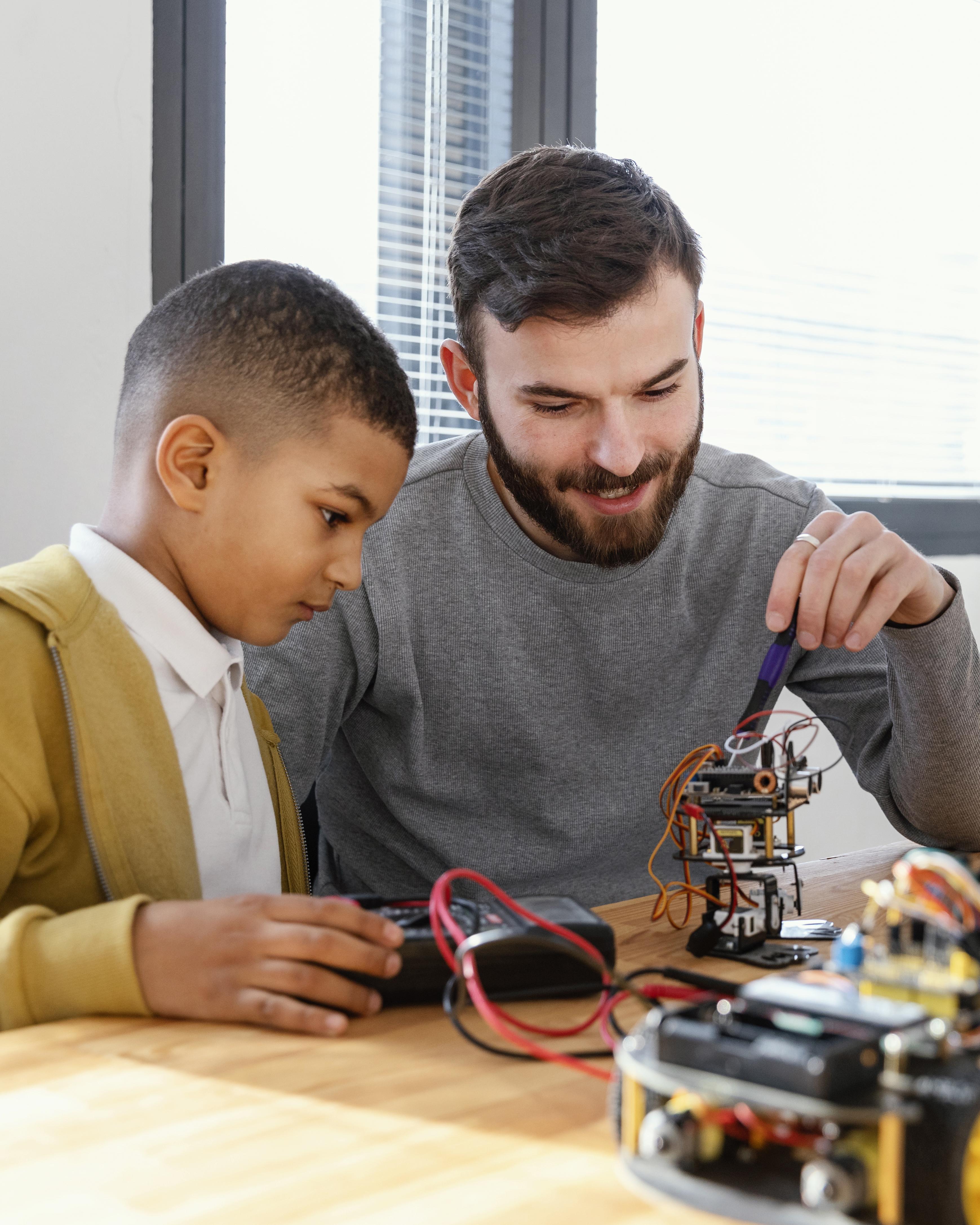 Photo: Mentor and student reviewing test results of a STEM project