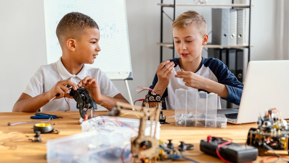 Header image: Students building a small robot together